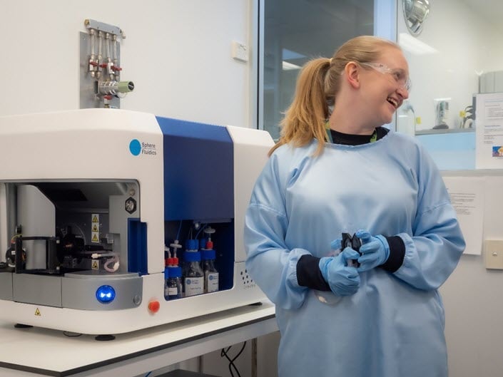 woman-smiling-in-a-lab.jpg