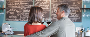 A couple at a wine bar on a date