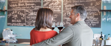 A couple at a wine bar on a date