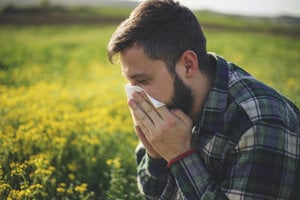 Man with asthma suffers from seasonal allergies