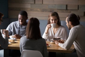 People talking and having a coffe