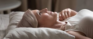 Woman lying in bed