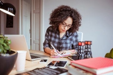 Woman with ADHD successfully managing her business from home