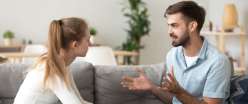 couple arguing on the sofa