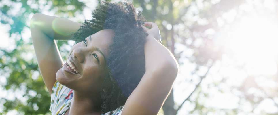 A woman with asthma breathes easy outdoors